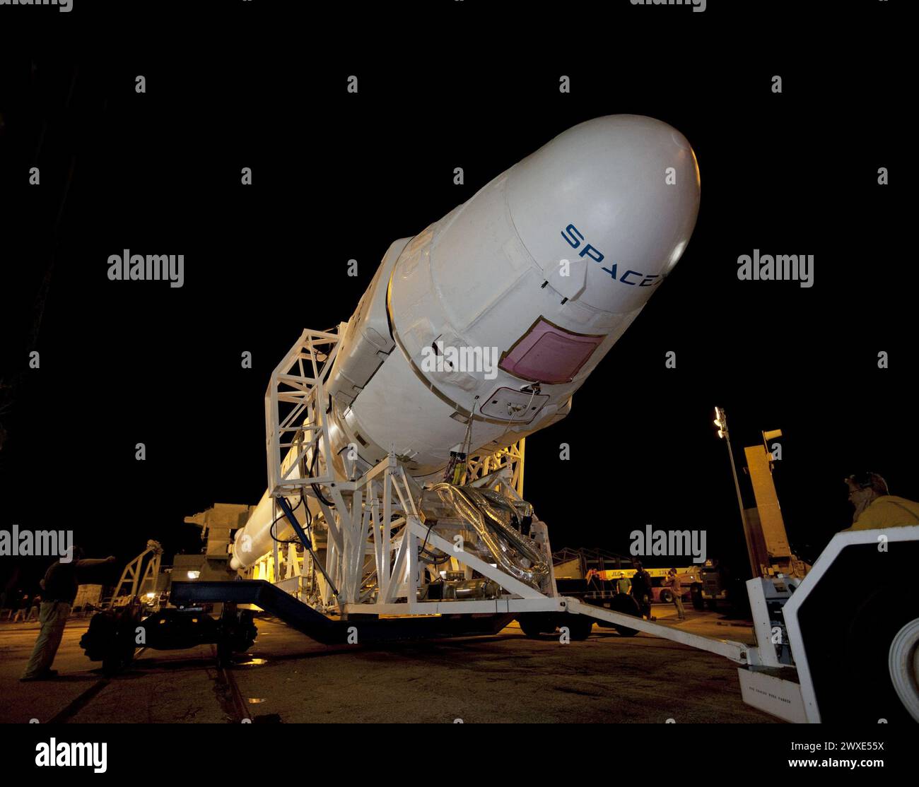 A Falcon 9 rocket with a Dragon capsule atop makes steady progress as it rolls from the processing hangar to the pad at Space Launch Complex 40, Cape Canaveral, Florida. Space Exploration Technologies Corp., or SpaceX, built both the rocket and capsule for NASA's first Commercial Resupply Services, or CRS-1, mission to the International Space Station. SpaceX CRS-1 is an important step toward making America's microgravity research program self-sufficient by providing a way to transport significant amounts of cargo to and from the ISS. Launch schedued: 7 October 2012. Credit: NASA/KShiflett Stock Photo