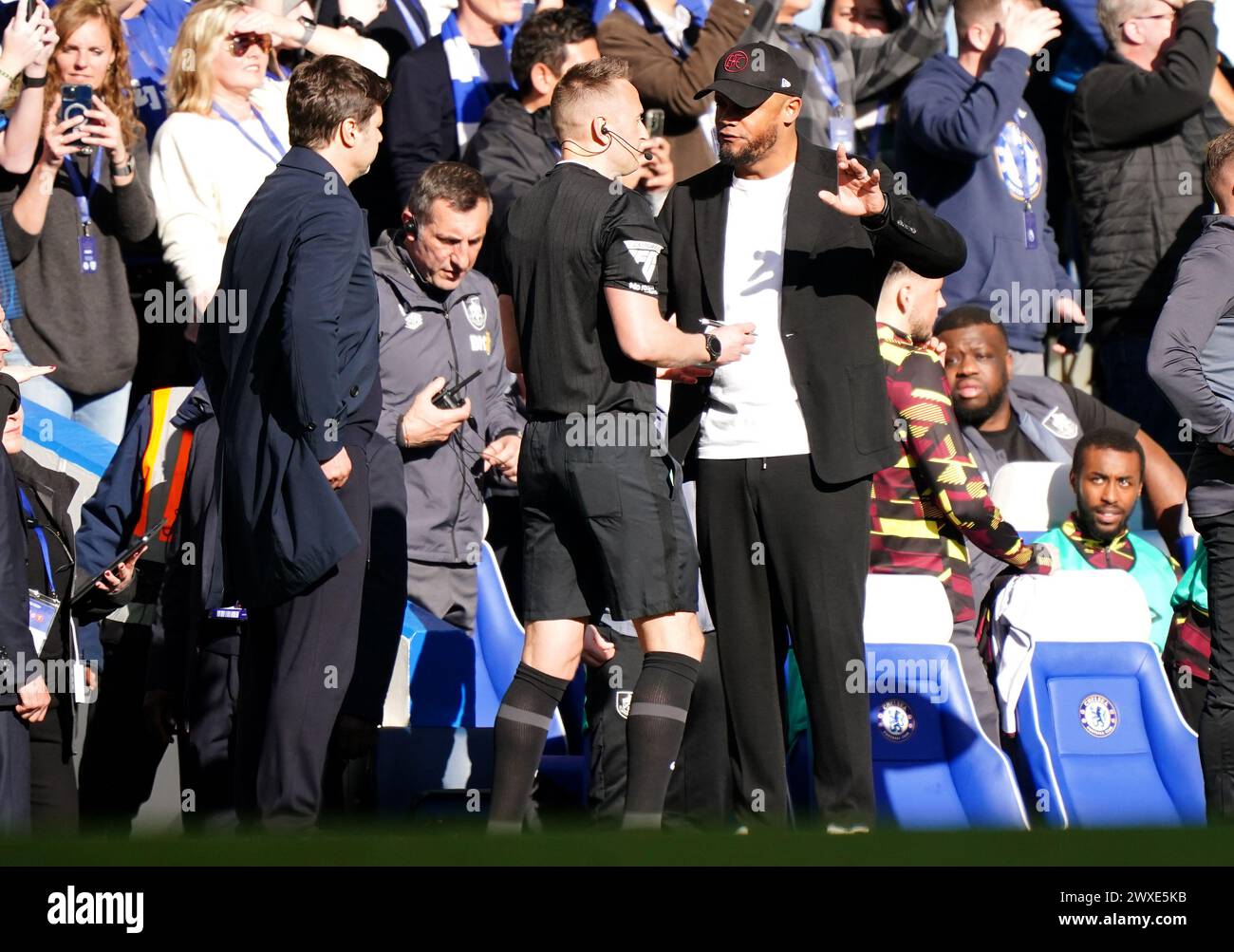 Burnley manager Vincent Kompany (right) reacts after being shown a red card by referee Darren England during the Premier League match at Stamford Bridge, London. Picture date: Saturday March 30, 2024. Stock Photo