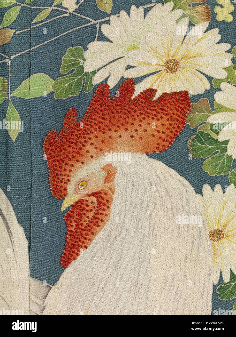 Cutaway of detail of a Japanese silk  Furisode kimono with detail of a cockerel with flowers. Anonymous, 1910-30. Japan . Stock Photo