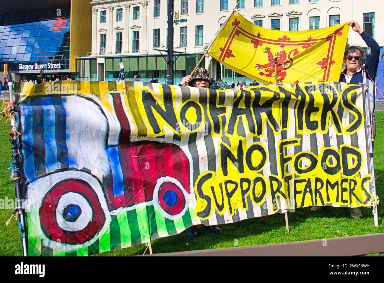 Glasgow, Scotland, UK. 30th March, 2024:   Farmers protest banner against who and its policies  in george square in front of the local government seat of city chambers this afternoon .  Credit Gerard Ferry /Alamy Live News Stock Photo