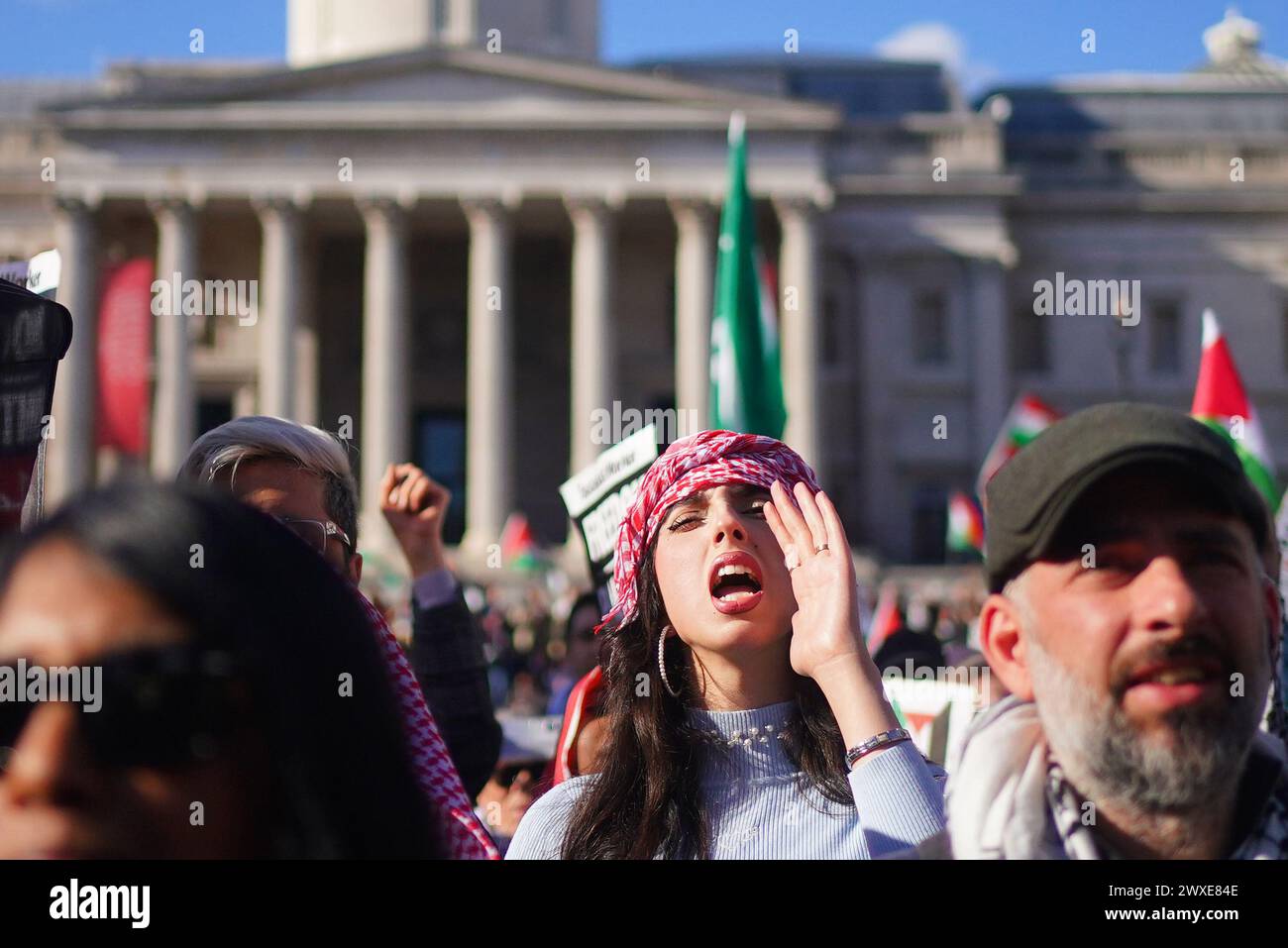 People taking part in Stop the Genocide in Gaza national demonstration in Trafalgar Square, central London. Picture date: Saturday March 30, 2024. Stock Photo