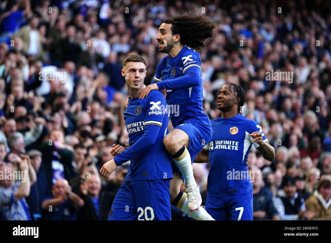 Chelsea's Cole Palmer (left) celebrates scoring their side's second goal of the game with team-mates during the Premier League match at Stamford Bridge, London. Picture date: Saturday March 30, 2024. Stock Photo