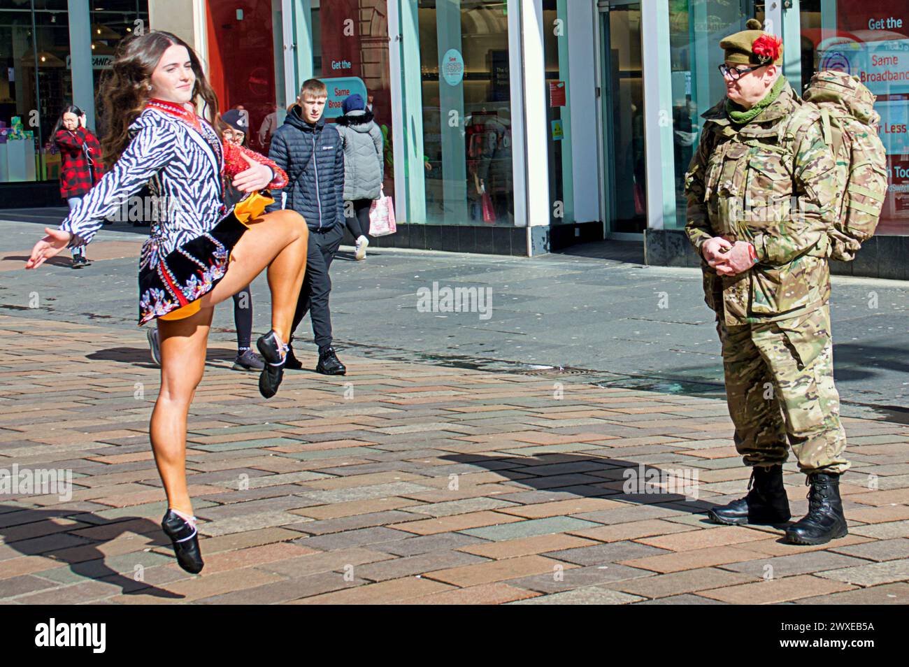 Glasgow, Scotland, UK. 30th March, 2024:   The World Irish Dancing Championships came to the style mile and shopping capital of Scotland Buchanan street this afternoon as dancers showed their moves to local shoppers in the sunshine  .  Credit Gerard Ferry /Alamy Live News Stock Photo