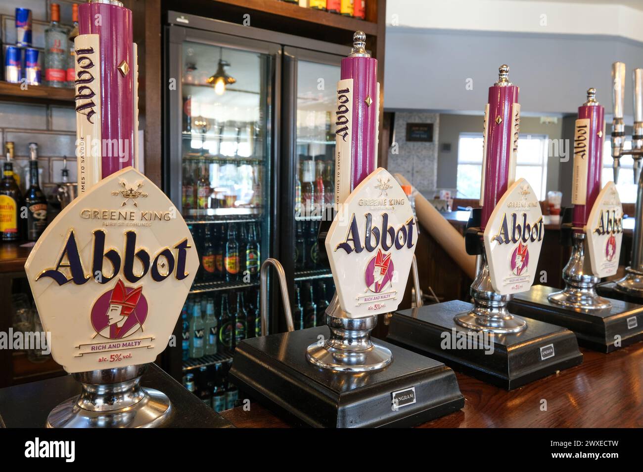 Abbot Ale pumps in a Greene King pub Stock Photo