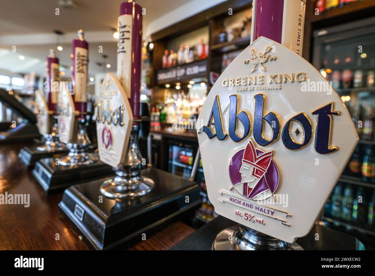 Abbot Ale pumps in a Greene King pub Stock Photo