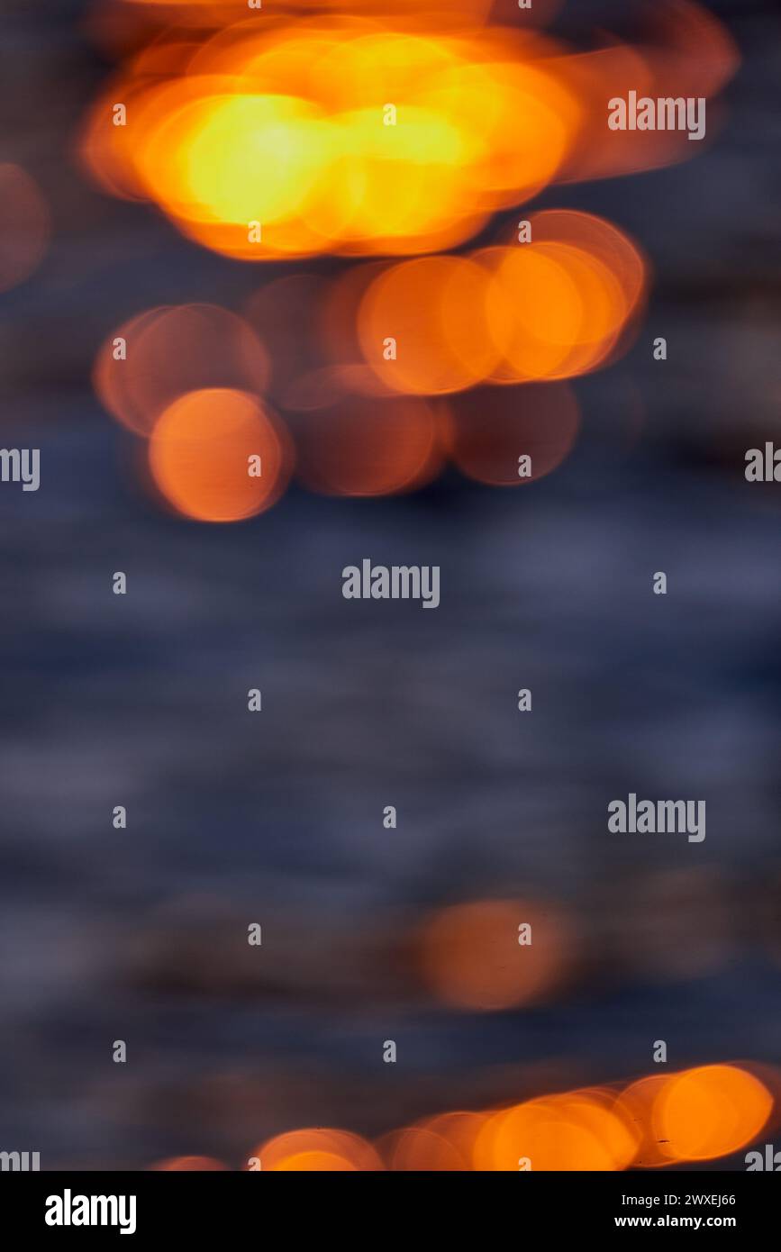 Gilded Ripples Dance Upon Molten Waters Stock Photo