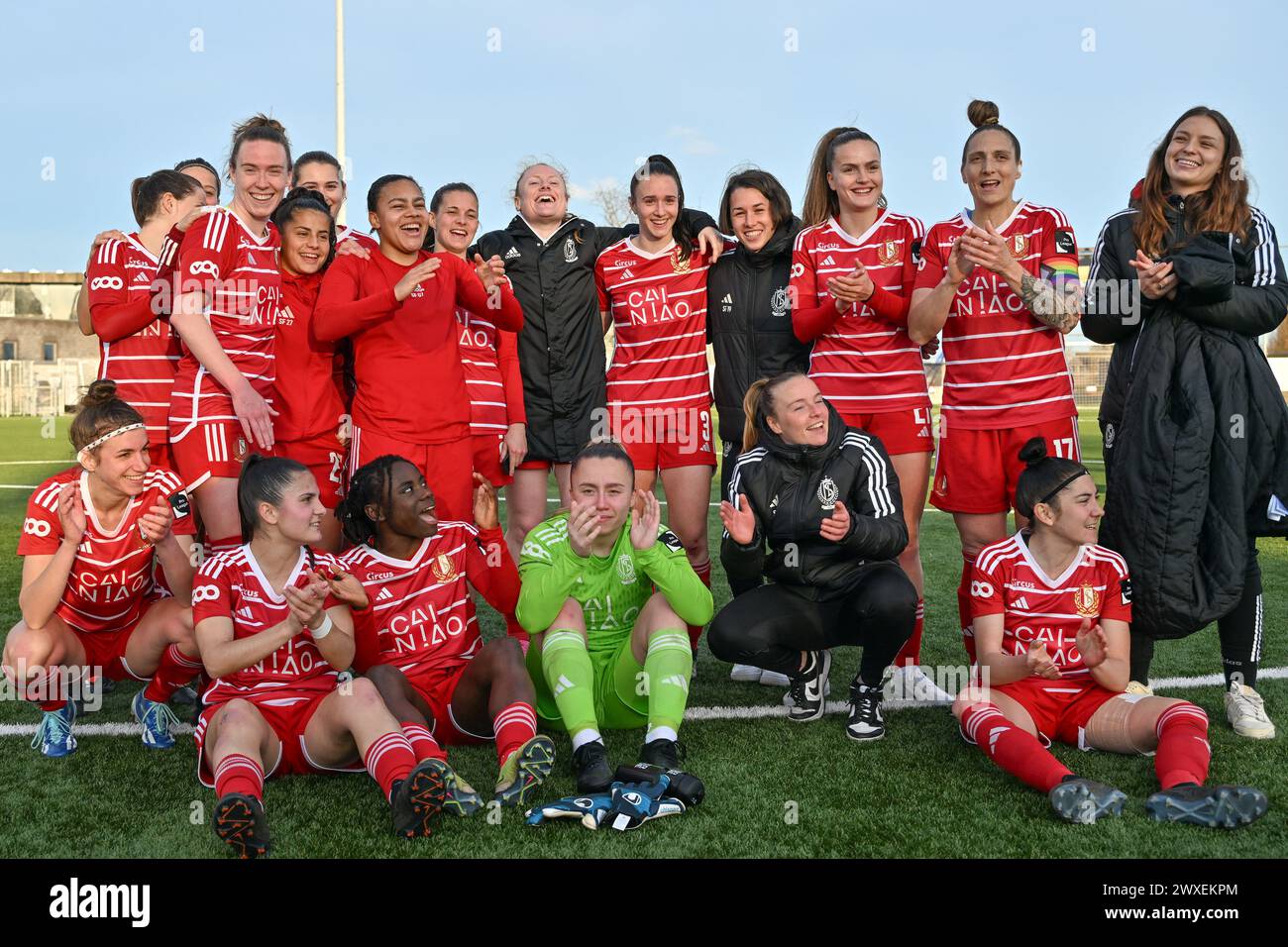 players of Standard celebrate after winning a female soccer game