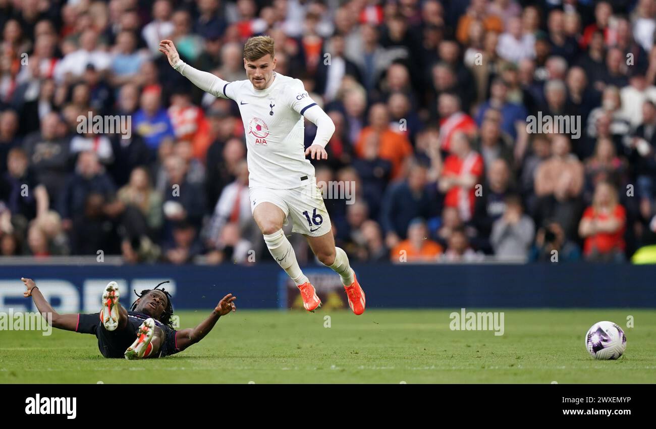 LONDON, ENGLAND - MARCH 30: Timo Werner of Tottenham Hotspur being tackled during the Premier League match between Tottenham Hotspur and Luton Town at Tottenham Hotspur Stadium on March 30, 2024 in London, England.(Photo by Dylan Hepworth/MB Media) Stock Photo