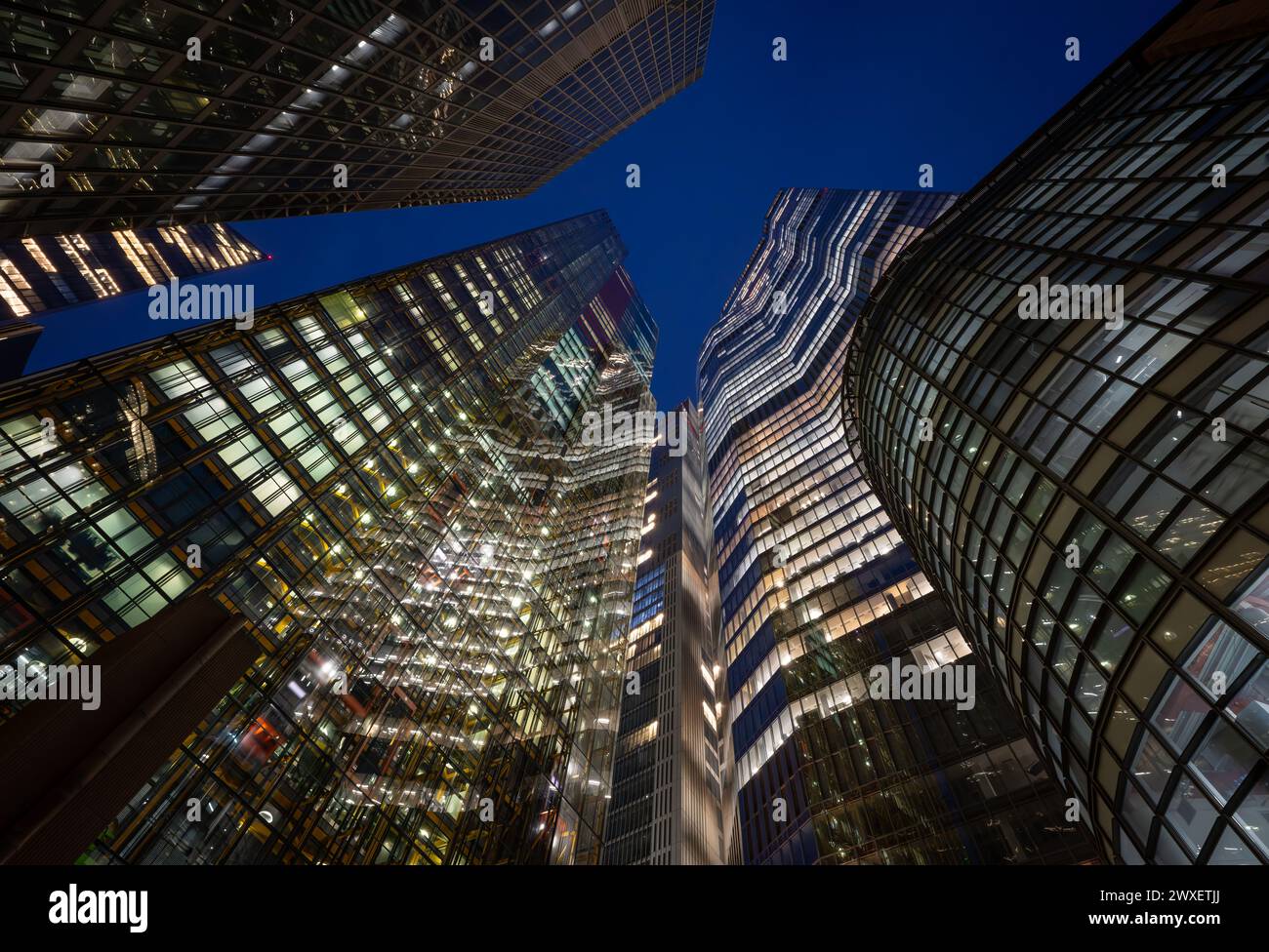 London, UK: Tall buildings in the City of London at night. Including (L-R): St Helen's, the Scalpel, the Cheesegrater, 8 Bishopsgate, 22 Bishopsgate. Stock Photo