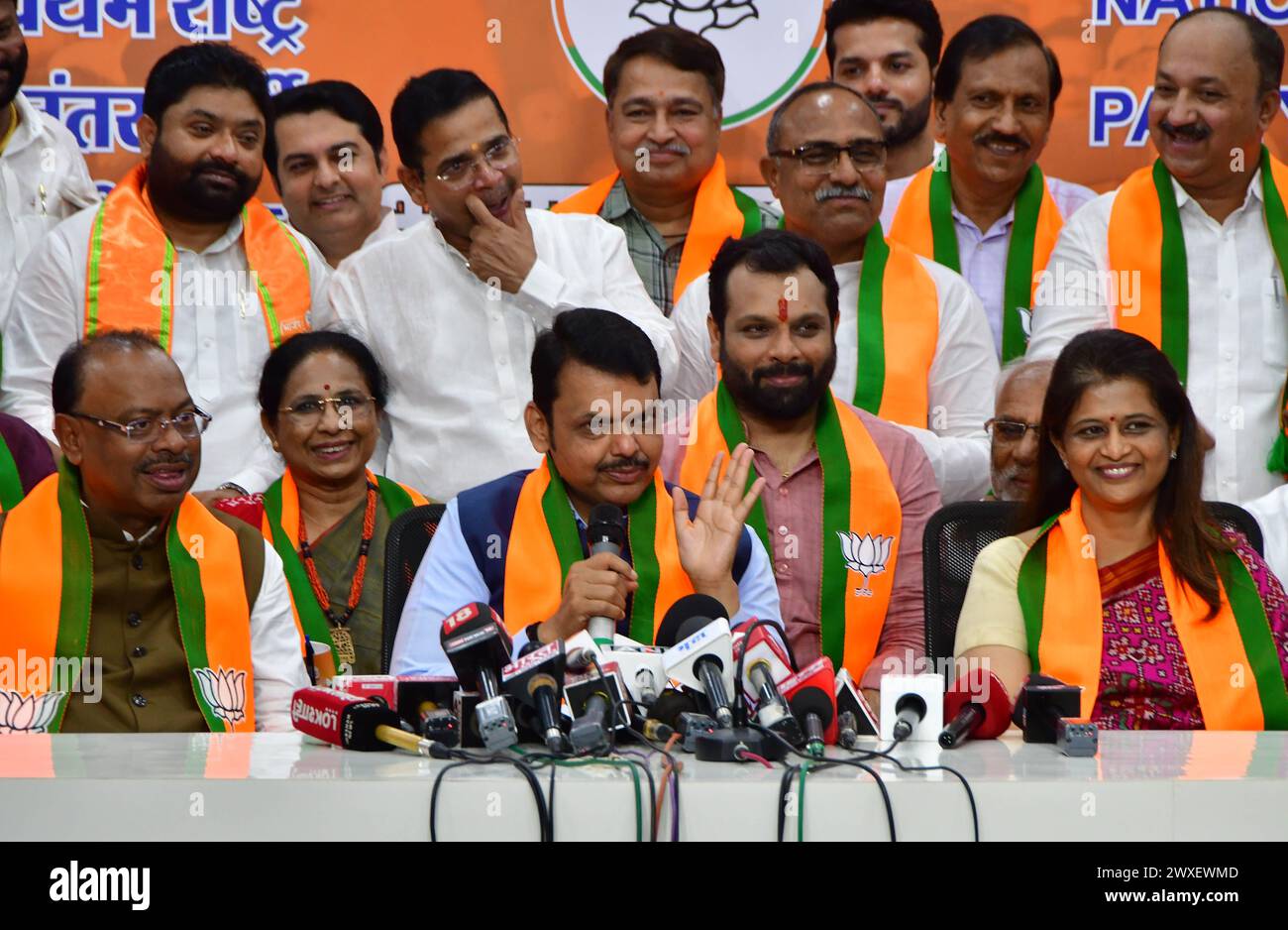 MUMBAI, INDIA - MARCH 30: Former Lok Sabha Speaker Shivraj Patil's daughter Archana Patil Chakurkar joins BJP in the presence of Maharashtra Dy CM Devendra Fadnavis and Maharashtra BJP President Chandrashekar Bawankule, on March 30, 2024 in Mumbai, India. Archana Patil said she has been associated with social work for the last two decades and decided to choose the BJP for politics. Shivraj Patil, who hails from Latur in Marathwada region of Maharashtra, was Union home minister during the UPA-I government, but stepped down in the wake of the 26/11 Mumbai terror attacks. (Photo by Bhushan Koyand Stock Photo