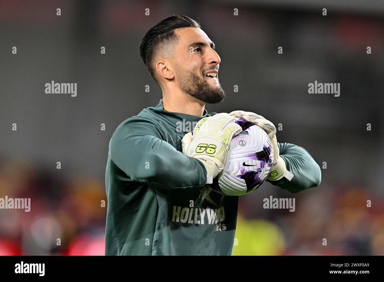 Thomas Strakosha of Brentford in the pregame warmup session during the Premier League match Brentford vs Manchester United at The Gtech Community Stadium, London, United Kingdom, 30th March 2024  (Photo by Cody Froggatt/News Images) Stock Photo