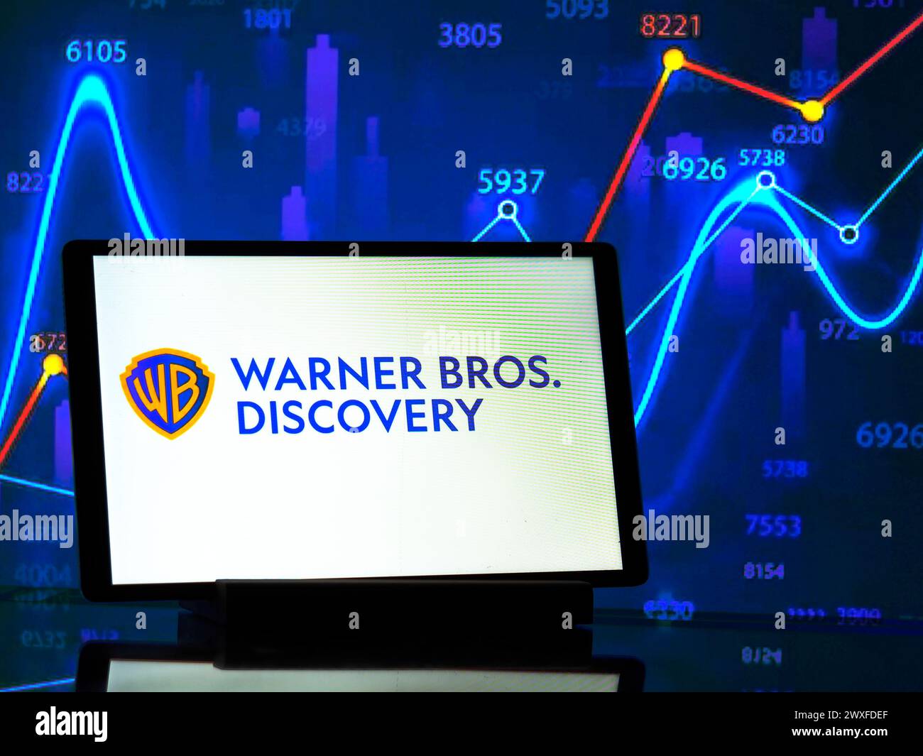 Germany - March 30, 2024:   In this photo illustration,  Warner Bros. Discovery, Inc.  logo seen displayed on a tablet Stock Photo