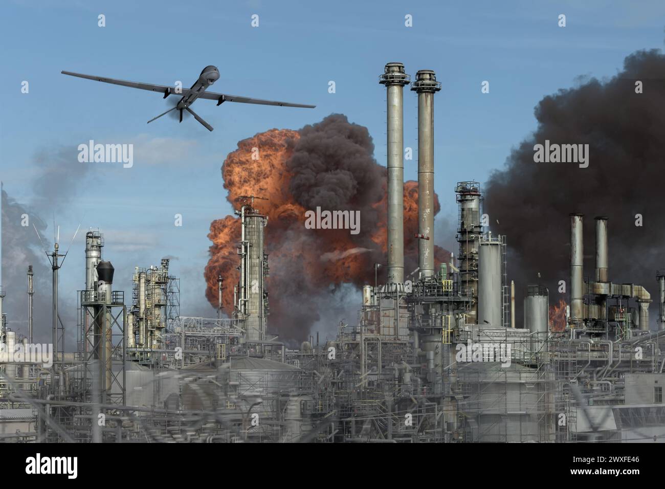 Drone flying over oil depot, oil tank burning and smoking, refinery fire, drone attack. Stock Photo
