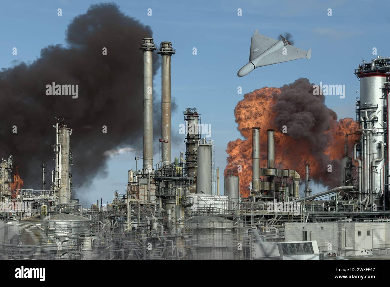 an unmanned drone attacks an oil depot, oil burns and smokes, a fire at an oil refinery. Stock Photo