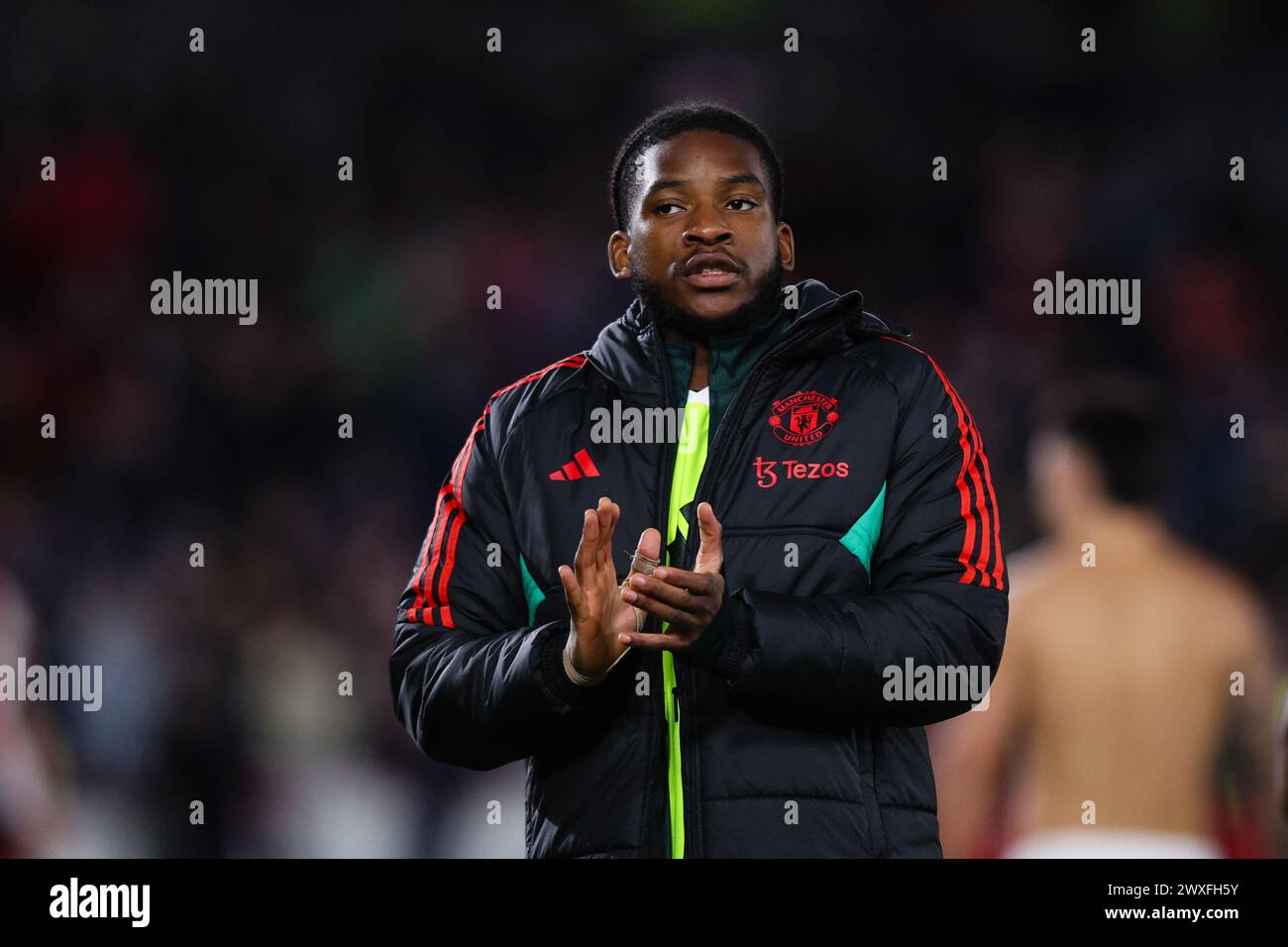 LONDON, UK - 30th Mar 2024:  Willy Kambwala of Manchester United applauds the fans after the Premier League match between Brentford FC and Manchester United FC at the Gtech Community Stadium  (Credit: Craig Mercer/ Alamy Live News) Stock Photo