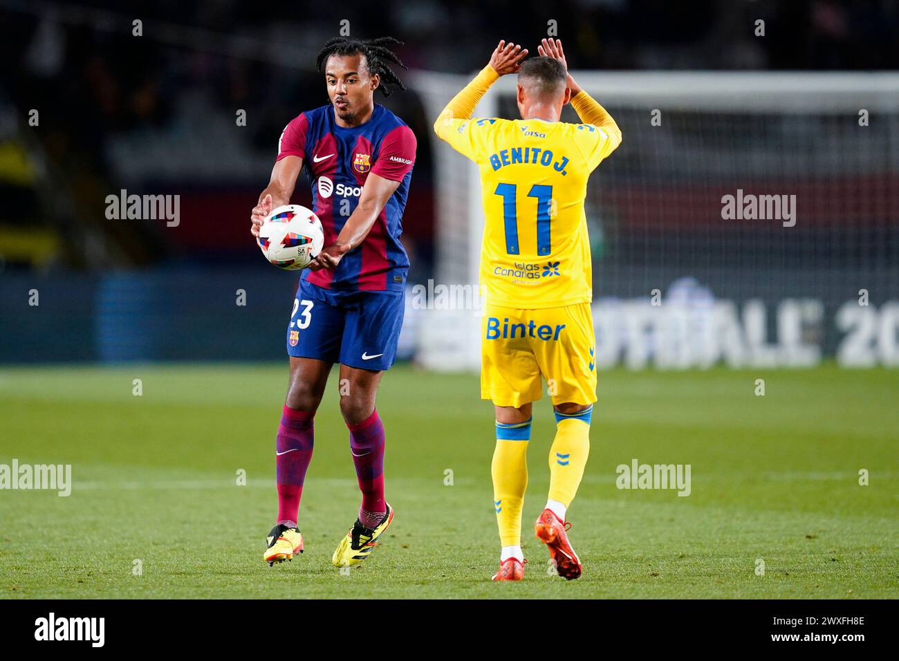 Barcelona, Spain. 30th Mar, 2024. Jules Kounde of FC Barcelona and Benito Ramirez of UD Las Palmas during the La Liga EA Sports match between FC Barcelona and UD Las Palmas played at Lluis Companys Stadium on March 30, 2024 in Barcelona, Spain. (Photo by Sergio Ruiz/PRESSINPHOTO) Credit: PRESSINPHOTO SPORTS AGENCY/Alamy Live News Stock Photo