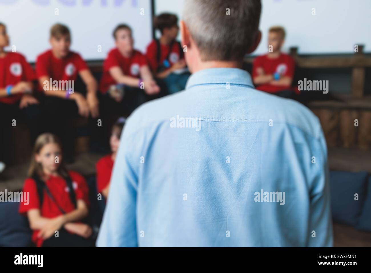 Group of students and school pupils in a science museum exhibition