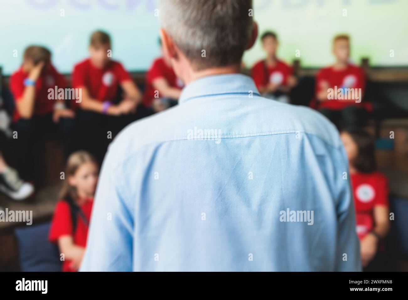 Group of students and school pupils in a science museum exhibition