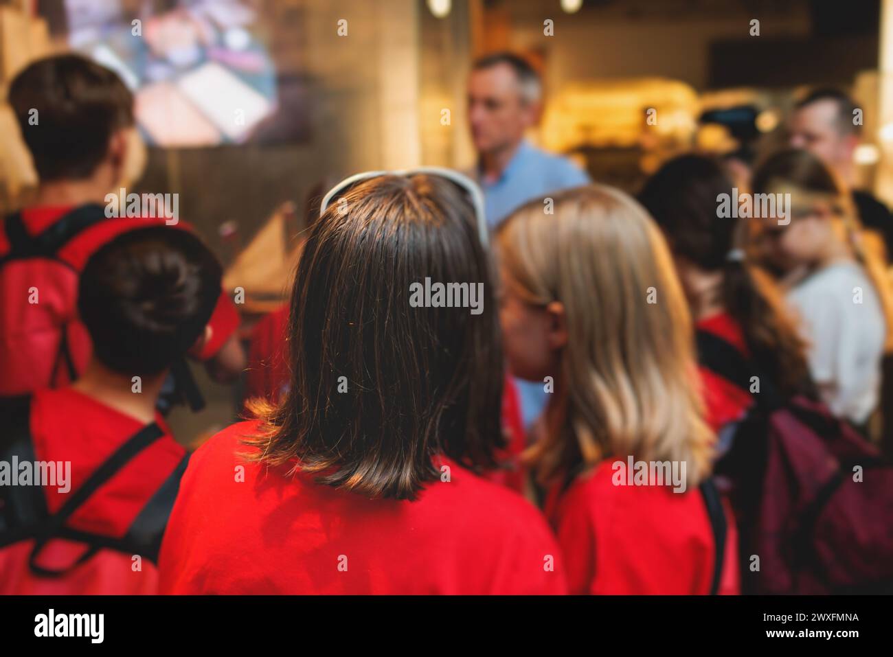 Group of students and school pupils in a science museum exhibition