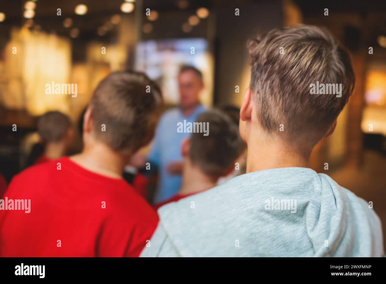 Group of students and school pupils in a science museum exhibition