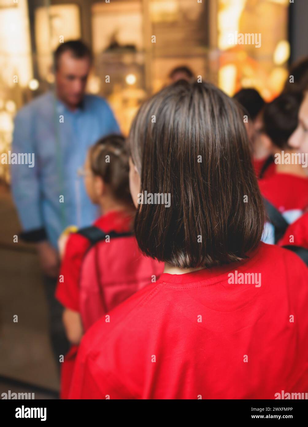 Group of students and school pupils in a science museum exhibition