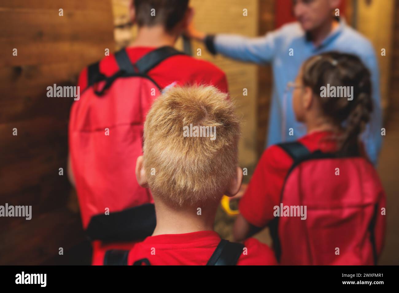 Group of students and school pupils in a science museum exhibition