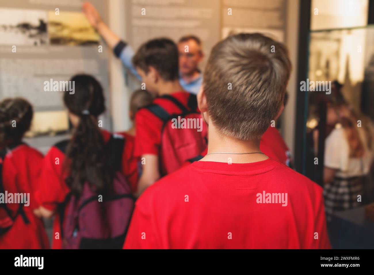 Group of students and school pupils in a science museum exhibition