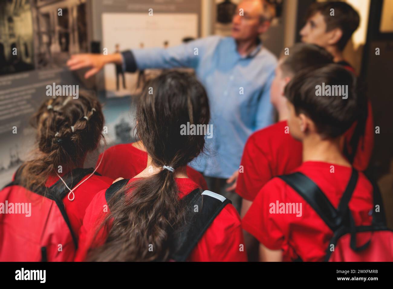Group of students and school pupils in a science museum exhibition