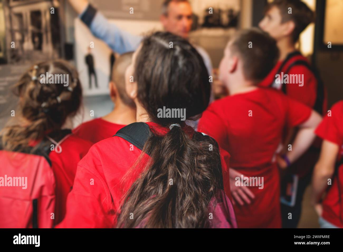 Group of students and school pupils in a science museum exhibition
