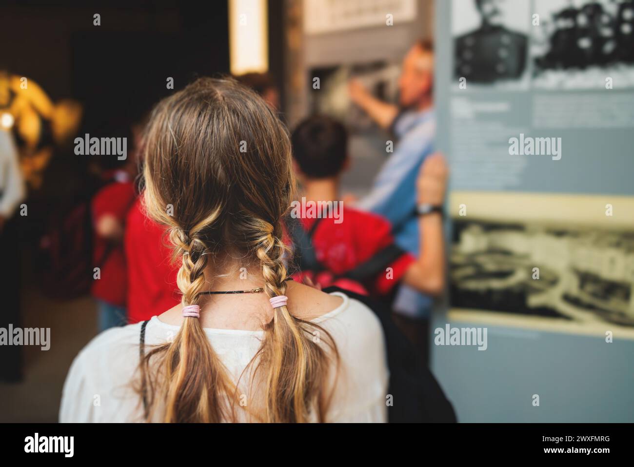 Group of students and school pupils in a science museum exhibition
