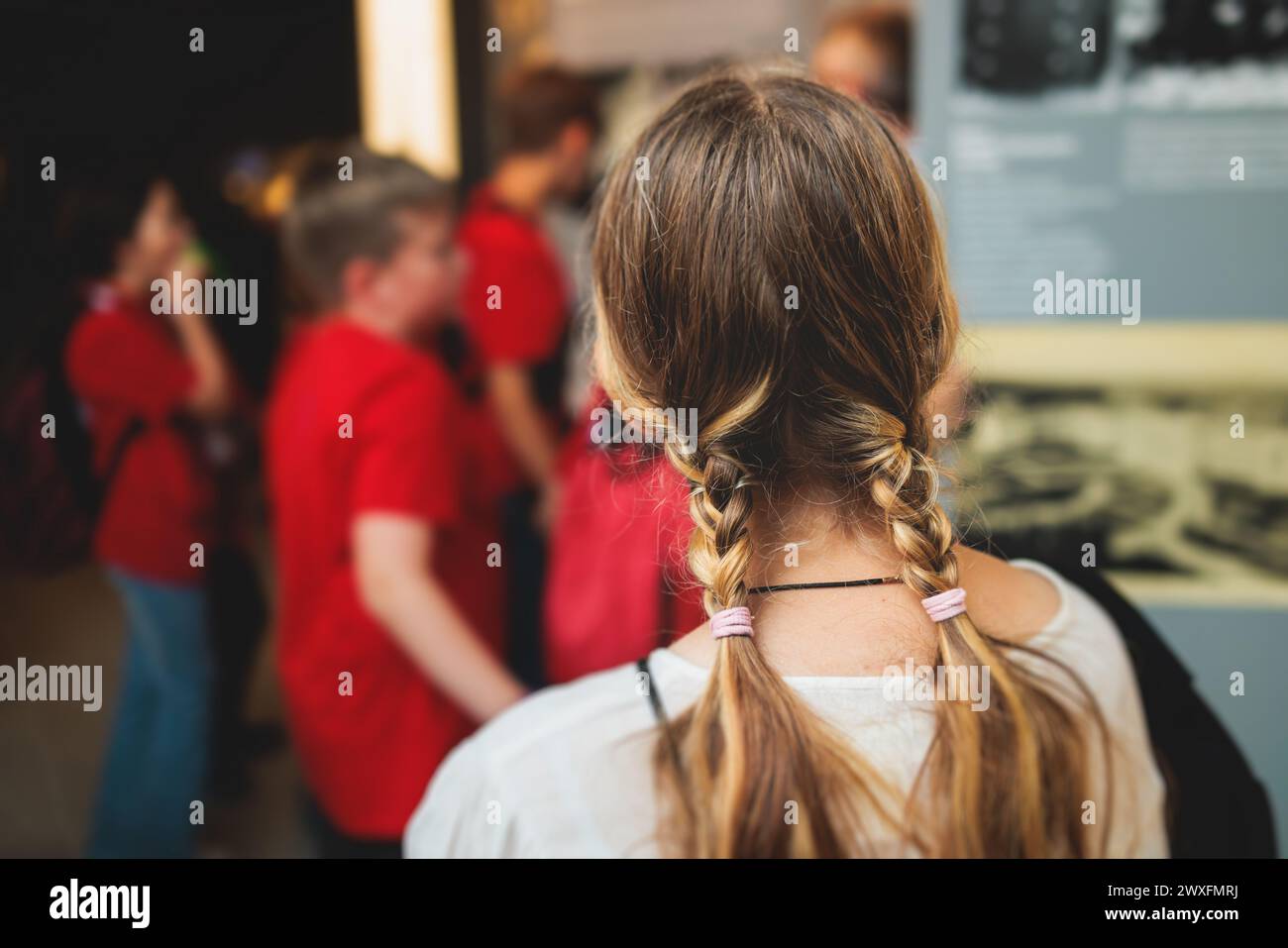 Group of students and school pupils in a science museum exhibition