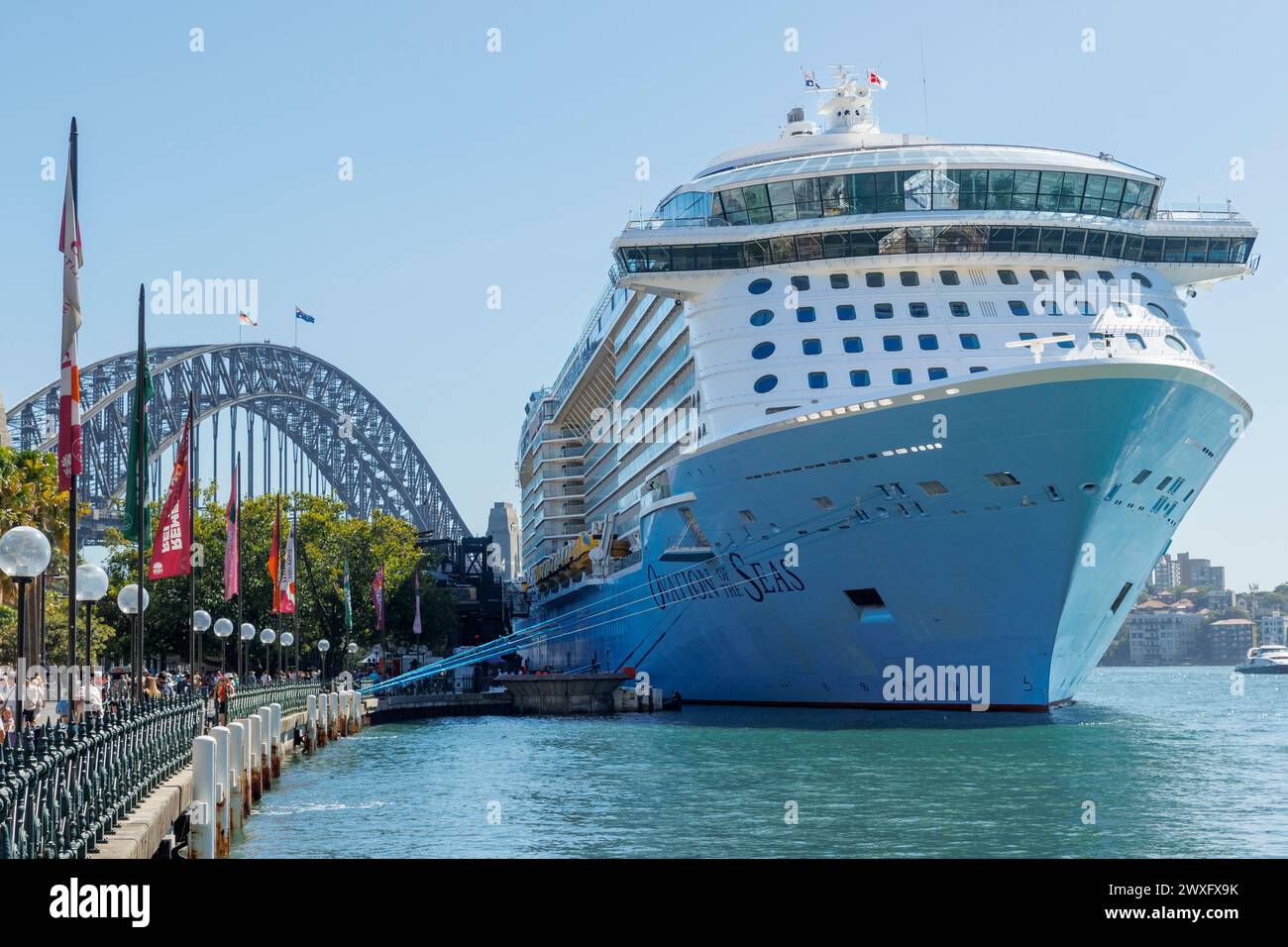Ovation of the Seas cruise ship berthed in front of harbour bridge in