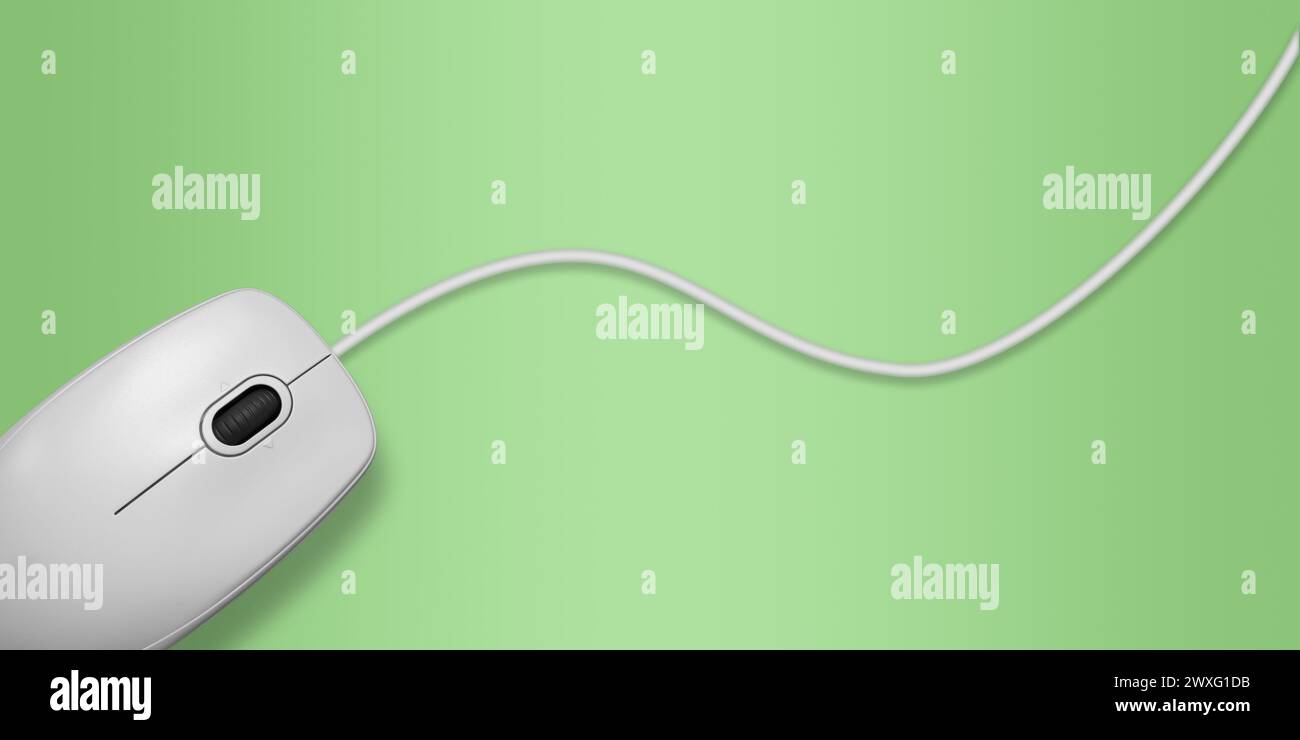 Light gray computer mouse with a wire on a green background. Close-up, top view Stock Photo