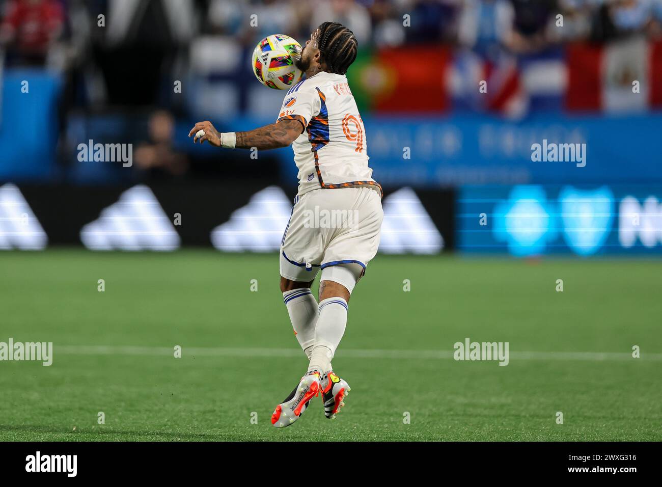 Charlotte, North Carolina, USA. 30th Mar, 2024. FC Cincinnati defender DEANDRE YEDLIN (91) gets a header during the first half of the Charlotte FC vs FC Cincinnati MLS match at Bank of America Stadium in Charlotte, NC on March 30, 2024. (Credit Image: © Cory Knowlton/ZUMA Press Wire) EDITORIAL USAGE ONLY! Not for Commercial USAGE! Stock Photo