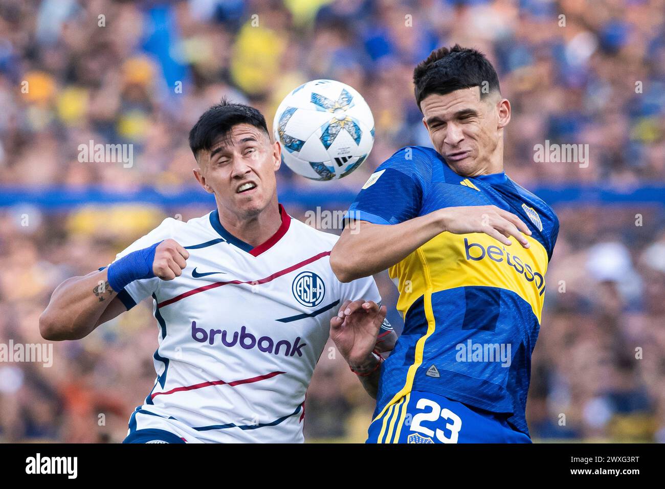 Buenos Aires, Argentina. 30th Mar, 2024. Lautaro Blanco of Boca Juniors competes for the ball with Adam Bareiro of San Lorenzo during a group B match between Boca Juniors and San Lorenzo at Estadio Alberto J. Armando. Final Score: Boca Juniors 2 - 1 San Lorenzo Credit: SOPA Images Limited/Alamy Live News Stock Photo