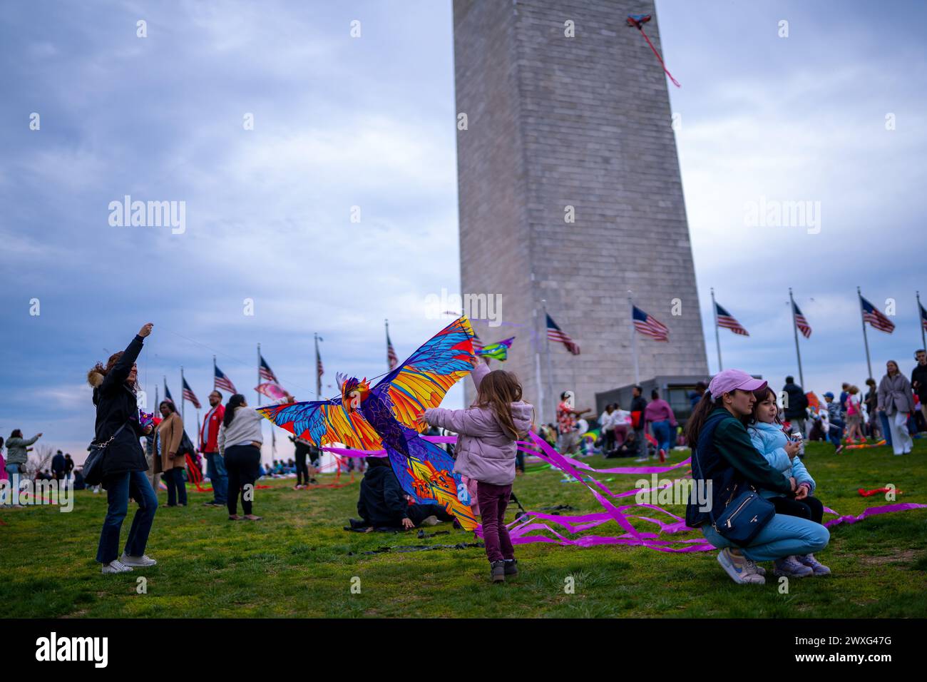 Washington, District Of Columbia, USA. 30th Mar, 2024. Colorful kites soared against the backdrop of the iconic Washington Monument during the 2024 Blossom Kite Festival. Enthusiastic kite fliers of all ages gathered on the National Mall, their creations dancing in the spring breeze. A cherished tradition that has spanned over 50 years, this year's festival was a celebration of art, community and the joy of flight. (Credit Image: © Natascha Tahabsem/ZUMA Press Wire) EDITORIAL USAGE ONLY! Not for Commercial USAGE! Credit: ZUMA Press, Inc./Alamy Live News Stock Photo