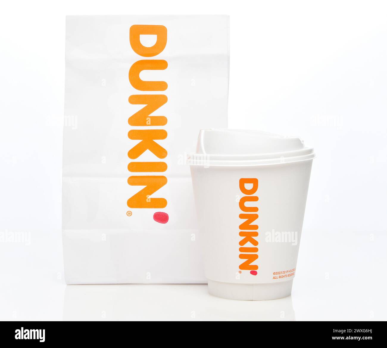 IRVINE, CALIFORNIA - 30 MAR 2024: A bag and Coffee Cup from Dunkin formerly called Dunkin Donuts. Stock Photo