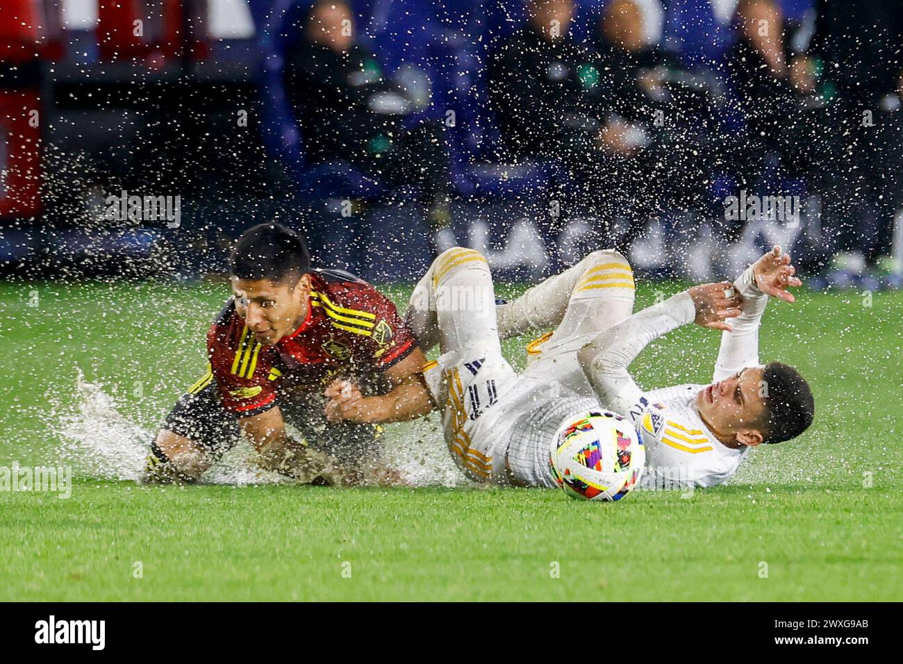 Carson, California, USA. 30th Mar, 2024. LA Galaxy's GABRIEL PEC, right, and Seattle Sounders' RAUL MARIO RUIDIAZ vie for the ball during an MLS soccer match at Dignity Health Sports Park in Carson, Calif. (Credit Image: © Ringo Chiu/ZUMA Press Wire) EDITORIAL USAGE ONLY! Not for Commercial USAGE! Stock Photo