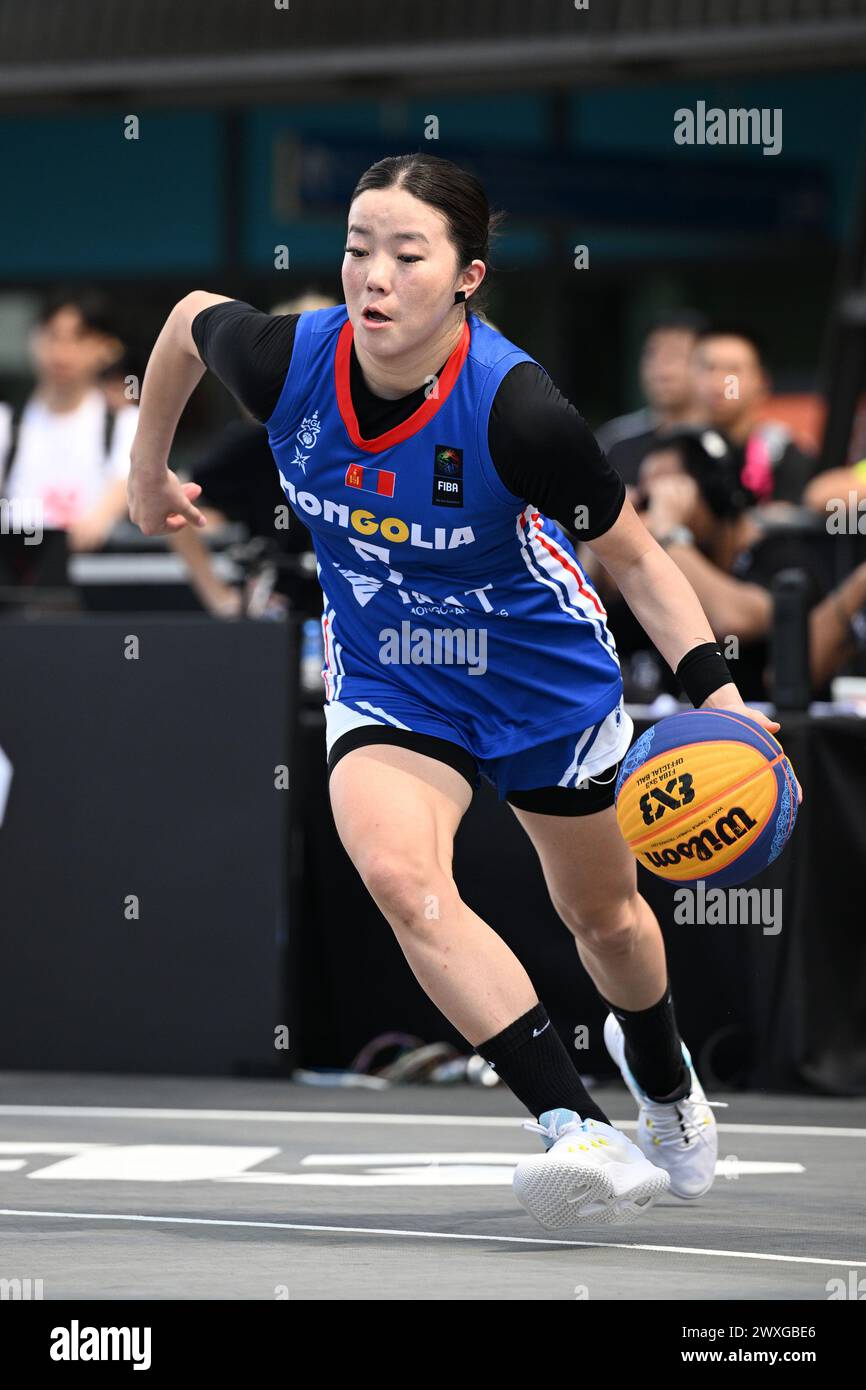 Singapore. 31st Mar, 2024. Ariunsetseg Bat-Erdene of Mongolia dribbles ...