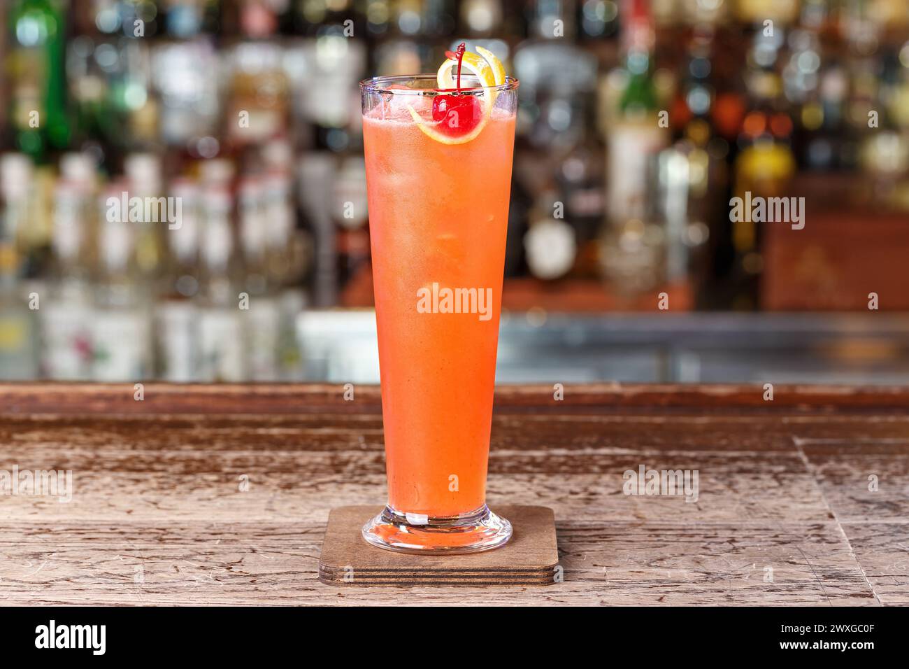 Strawberry club cocktail on the basis of gin, decorated with cherries and  lemon zest. Space for text design Stock Photo - Alamy