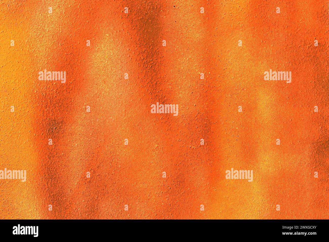Bright orange vibrant paint abstract pattern surface wall texture background color backdrop. Stock Photo
