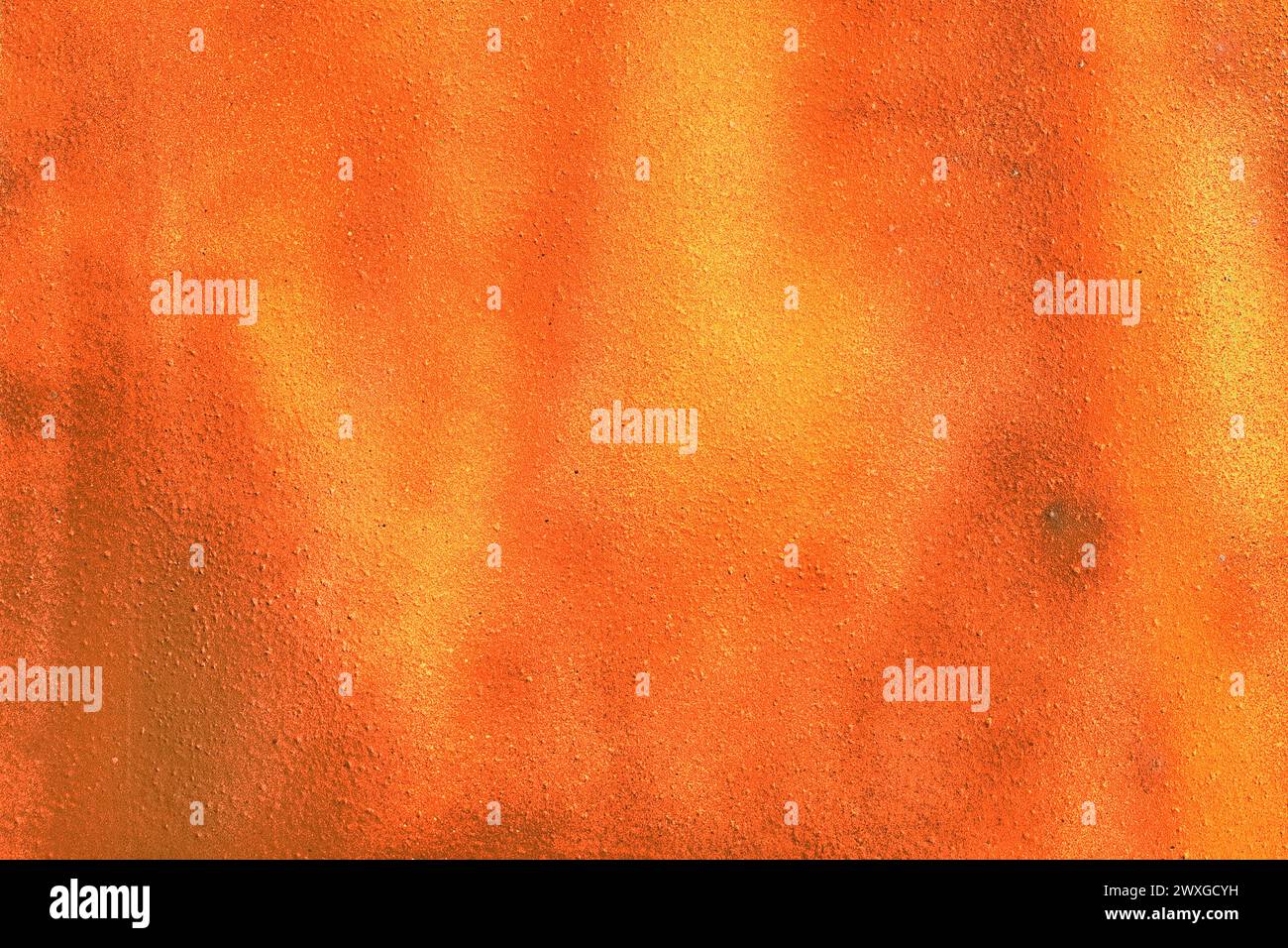 Bright orange vibrant paint abstract pattern surface wall texture background color. Stock Photo