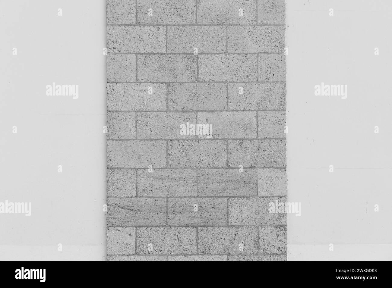 Grey sand brickwork brick masonry wall sample object on white background architecture facade exterior building background. Stock Photo