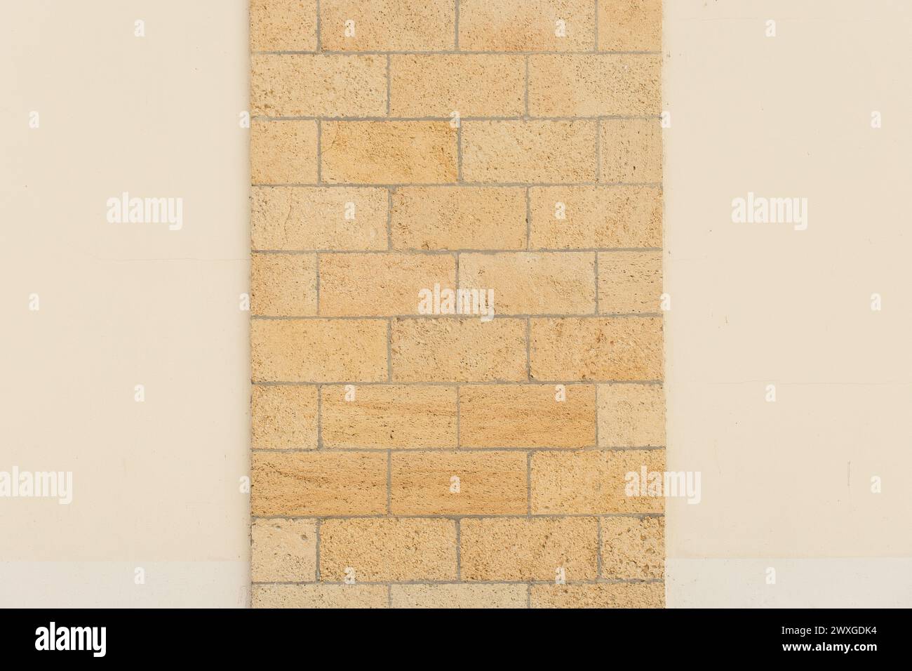 Light yellow sand wall brick blocks masonry shell texture background object design. Stock Photo
