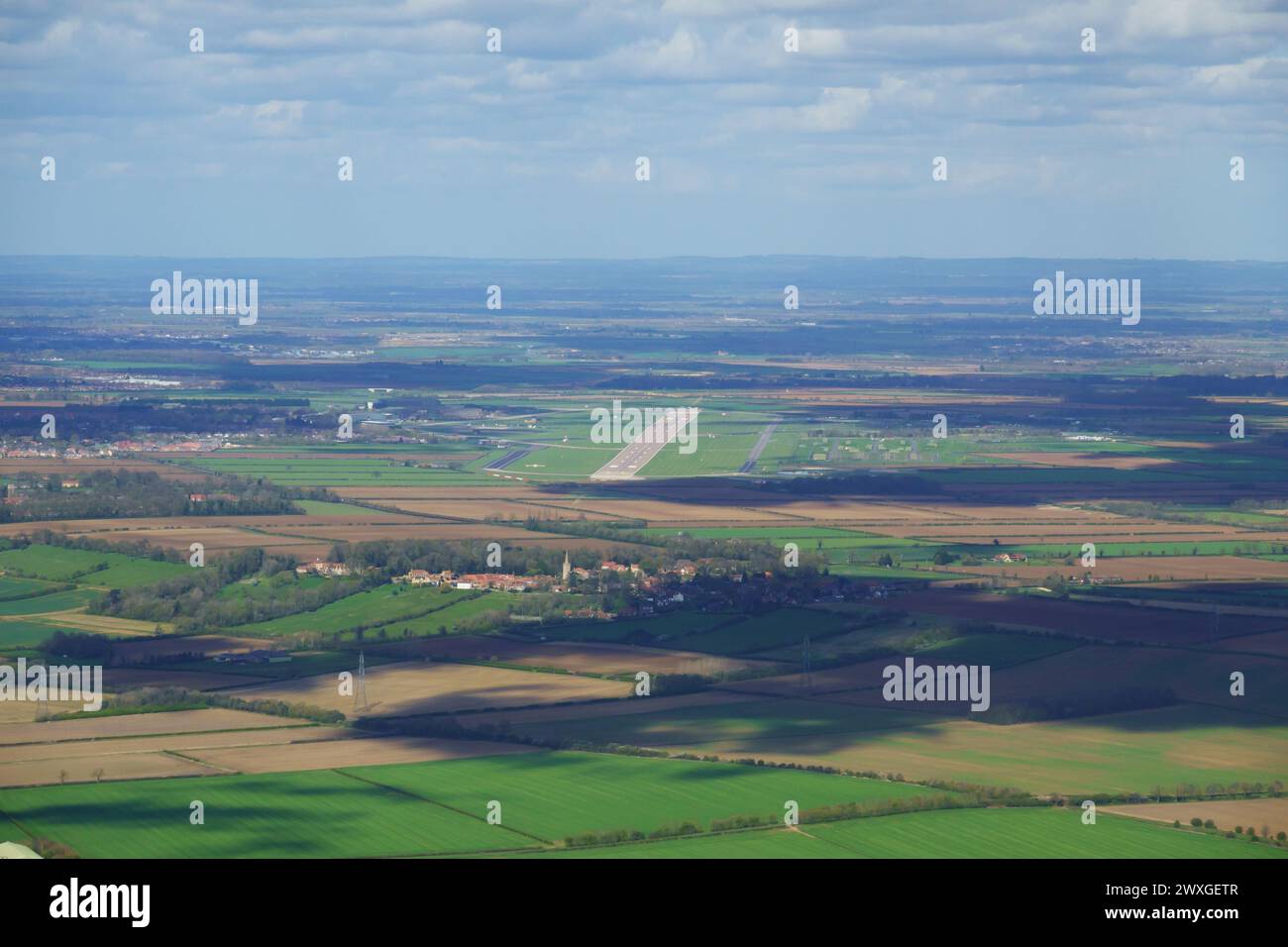 Aerial view over Coleby village with RAF Waddington runway, Lincolnshire, England. Stock Photo