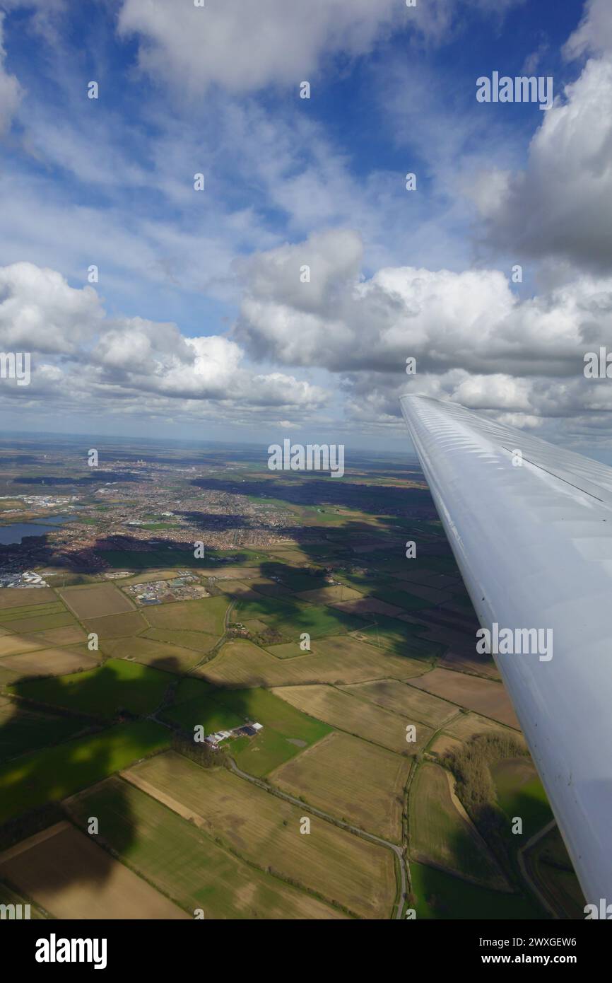Aerial view along a planes wing of Lincoln, Lincolnshire, England. Stock Photo