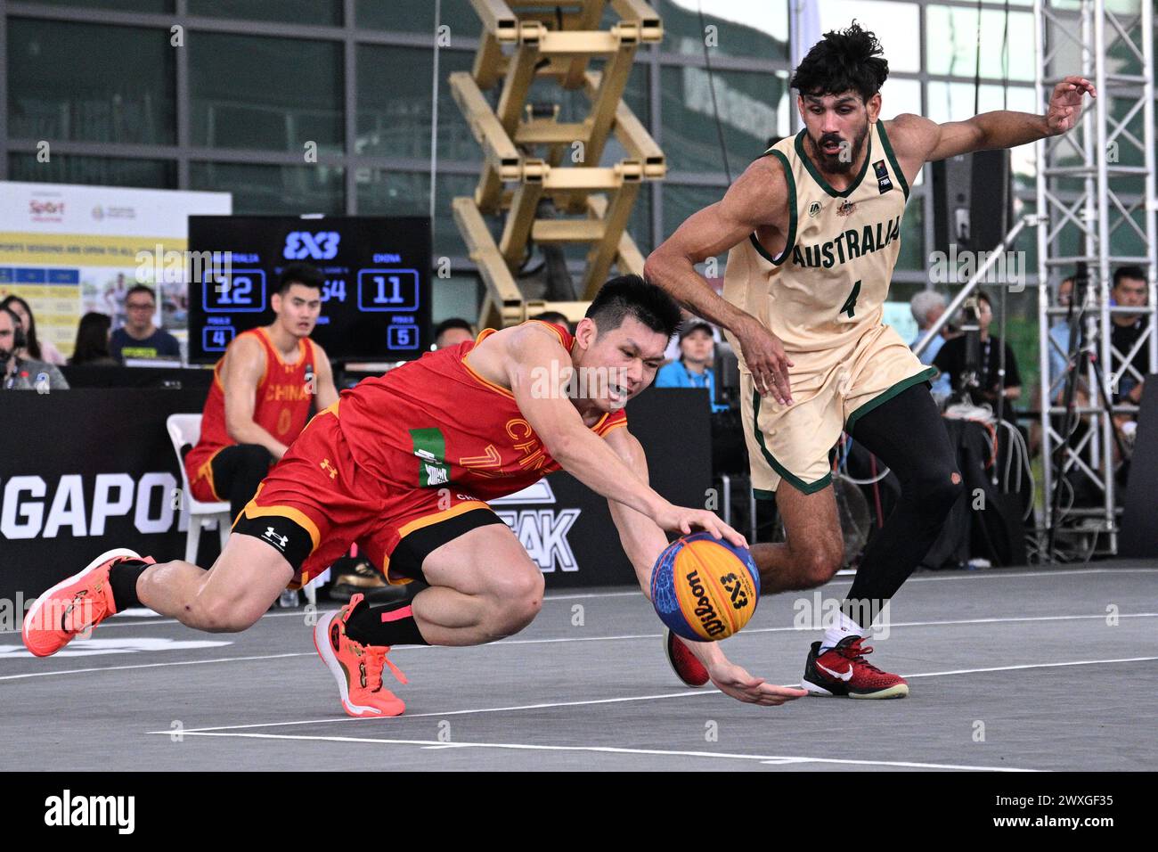 Singapore. 31st Mar, 2024. Wu Xingrui (L) of China competes for the