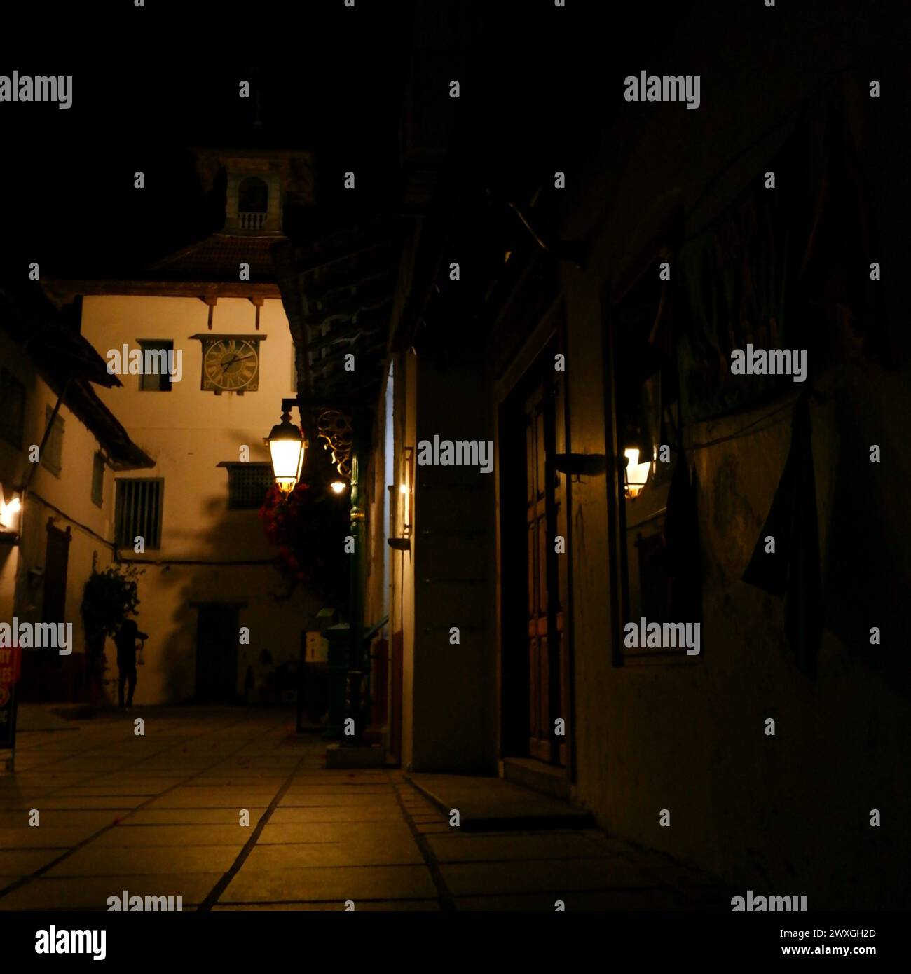 town alleyway vintage clock European style Stock Photo