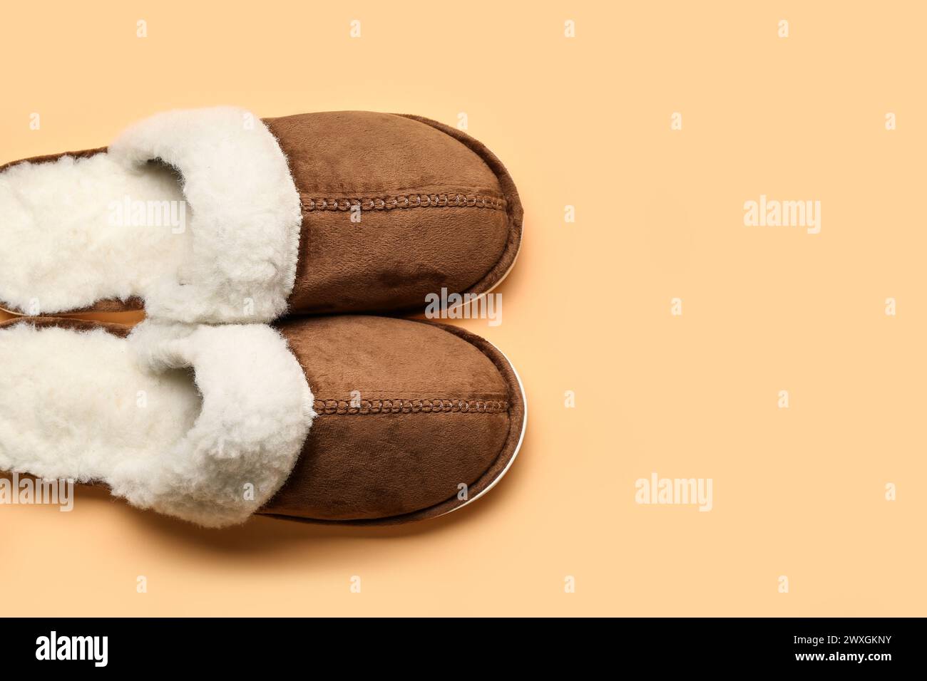 Woman wearing soft brown slippers hi-res stock photography and images ...