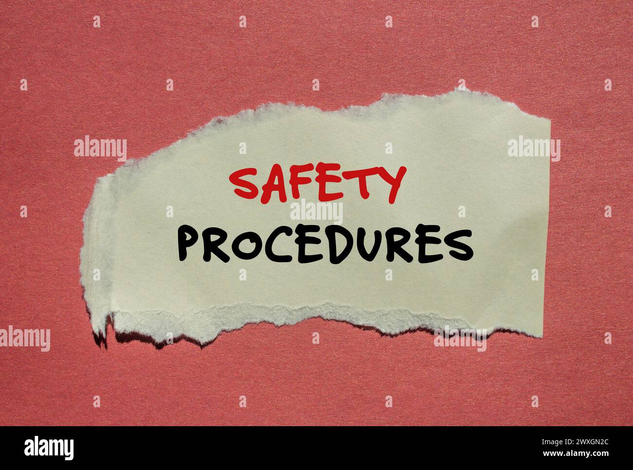 Safety procedures words written on torn paper piece with red background. Conceptual symbol. Copy space. Stock Photo